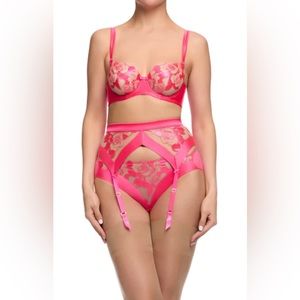 Embroidery on soft tulle with satin banding detail.